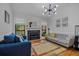 Comfortable living room with a fireplace, hardwood floors, and stylish furniture at 58 Indigo Ln, Goose Creek, SC 29445