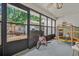Enclosed patio with outdoor toys and views of the fenced-in yard and outdoor grill at 58 Indigo Ln, Goose Creek, SC 29445