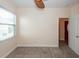 A cozy bedroom with a ceiling fan and natural light at 611 Grassy Hill Rd, Summerville, SC 29483