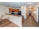Open kitchen with breakfast bar, wooden cabinets, and easy access to the dining area at 611 Grassy Hill Rd, Summerville, SC 29483