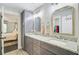 Bathroom with double sinks, granite countertops, and gray cabinets at 6190 Button Bush Dr, Ravenel, SC 29470