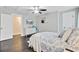 Bedroom with ceiling fan, mounted television, and dresser at 6190 Button Bush Dr, Ravenel, SC 29470