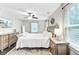 Bedroom featuring hardwood floor, ceiling fan, and mounted television at 6190 Button Bush Dr, Ravenel, SC 29470