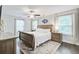 Bedroom with ceiling fan, plush rug, and lots of natural light at 6190 Button Bush Dr, Ravenel, SC 29470