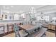 Open-concept living space with a dining table connecting the kitchen and living room at 6190 Button Bush Dr, Ravenel, SC 29470
