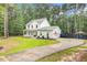 Spacious home with a long driveway, lush lawn, and privacy fence, perfect for Gathering living at 6190 Button Bush Dr, Ravenel, SC 29470