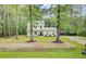 Charming two-story home with a covered front porch, perfect for enjoying the serene surroundings at 6190 Button Bush Dr, Ravenel, SC 29470