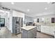 Spacious kitchen with stainless appliances, granite countertops, and gray island at 6190 Button Bush Dr, Ravenel, SC 29470
