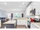 Open kitchen with granite countertops, stainless appliances, and an island at 6190 Button Bush Dr, Ravenel, SC 29470