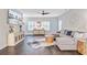 Bright and open living room featuring hardwood floors, stylish furniture, and ample natural light at 6190 Button Bush Dr, Ravenel, SC 29470