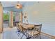 Enclosed patio features a lovely dining area with views of the backyard and pool at 6190 Button Bush Dr, Ravenel, SC 29470