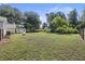 Expansive backyard with lush grass and mature trees, offering plenty of space for outdoor activities at 647 Ellis St, Mount Pleasant, SC 29464