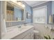 Well-lit bathroom featuring a vanity, mirror, and modern fixtures, creating a clean and inviting space at 647 Ellis St, Mount Pleasant, SC 29464