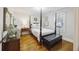 Comfortable bedroom featuring a four-poster bed, hardwood floors, and ample natural light for a relaxing atmosphere at 647 Ellis St, Mount Pleasant, SC 29464