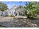 Charming home with a welcoming front porch, lush landscaping, and a well-maintained driveway at 647 Ellis St, Mount Pleasant, SC 29464