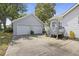 Charming home exterior featuring a detached two-car garage and a well-maintained concrete driveway at 647 Ellis St, Mount Pleasant, SC 29464