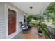 Inviting front porch with rocking chairs, potted plants, and a welcoming entrance to the home at 647 Ellis St, Mount Pleasant, SC 29464