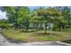 Charming home nestled on a lush green lot with mature trees and attractive landscaping for great curb appeal at 647 Ellis St, Mount Pleasant, SC 29464