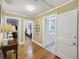 Hallway with hardwood flooring featuring multiple entryways into bedrooms and bathroom at 647 Ellis St, Mount Pleasant, SC 29464