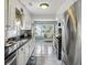 Bright kitchen with stainless steel appliances, granite countertops and tile floors at 647 Ellis St, Mount Pleasant, SC 29464