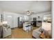Bright, open kitchen with stainless steel appliances, a functional island, and cozy seating area at 647 Ellis St, Mount Pleasant, SC 29464