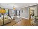 Bright living room with hardwood floors, neutral paint, and white furniture offering a welcoming atmosphere at 647 Ellis St, Mount Pleasant, SC 29464