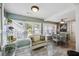 Sunroom with natural lighting, tile floors, and cozy seating for year-round enjoyment at 647 Ellis St, Mount Pleasant, SC 29464