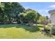 Expansive backyard with a pergola, a swing, and lush greenery providing a serene outdoor setting at 67 Regency Oaks Dr, Summerville, SC 29485