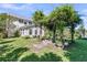 Lush backyard featuring a pergola with climbing plants, providing an outdoor living space and shade at 67 Regency Oaks Dr, Summerville, SC 29485