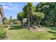 Lush backyard featuring a pergola covered in climbing plants, creating a peaceful and inviting outdoor retreat at 67 Regency Oaks Dr, Summerville, SC 29485