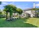 Backyard featuring a pergola covered in climbing plants, providing a shady outdoor space for entertaining at 67 Regency Oaks Dr, Summerville, SC 29485