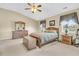 Cozy bedroom with a wooden bed frame, neutral walls, and matching wooden dressers at 67 Regency Oaks Dr, Summerville, SC 29485