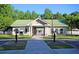Community clubhouse with well-manicured lawn and landscaping at 67 Regency Oaks Dr, Summerville, SC 29485