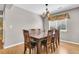 Formal dining room featuring a traditional wooden table and chairs, bathed in natural light at 67 Regency Oaks Dr, Summerville, SC 29485