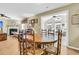 Open dining room and living room with fireplace, wood floors, and lots of natural light at 67 Regency Oaks Dr, Summerville, SC 29485