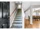 Inviting entryway features a staircase and a glimpse into the formal dining room at 67 Regency Oaks Dr, Summerville, SC 29485