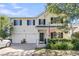 Charming two-story home featuring a two-car garage, well-kept landscaping, and an inviting front porch at 67 Regency Oaks Dr, Summerville, SC 29485