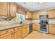 Eat-in kitchen with light wood cabinetry, modern stainless steel appliances and hardwood floors at 67 Regency Oaks Dr, Summerville, SC 29485