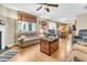Cozy living room featuring a fireplace, wood floors and neutral tones with views through to the kitchen at 67 Regency Oaks Dr, Summerville, SC 29485