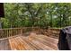 A wooden back deck overlooks a lush green backyard at 6840 Early Jersey Rd, Meggett, SC 29449
