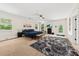 Large main bedroom features multiple windows, ceiling fan, and ensuite bathroom at 6840 Early Jersey Rd, Meggett, SC 29449