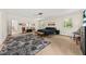 Bright bedroom features a ceiling fan, windows with natural light, and an ensuite bathroom at 6840 Early Jersey Rd, Meggett, SC 29449