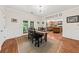 Charming dining area with hardwood floors, access to the kitchen, and natural light at 6840 Early Jersey Rd, Meggett, SC 29449
