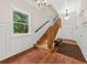 Inviting foyer featuring a staircase, tile floor, and a view of the outdoors at 6840 Early Jersey Rd, Meggett, SC 29449