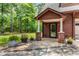 Up close, inviting entryway with stone and brick pillars, and mature landscaping at 6840 Early Jersey Rd, Meggett, SC 29449