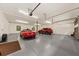 Spacious garage with multiple cars parked inside and overhead lighting at 6840 Early Jersey Rd, Meggett, SC 29449