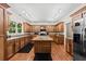 Spacious kitchen features custom wood cabinets, large island, and stainless steel appliances at 6840 Early Jersey Rd, Meggett, SC 29449