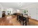 Spacious living area with wood floors, dining space, and natural light at 6840 Early Jersey Rd, Meggett, SC 29449