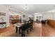 Open-concept living and dining area with hardwood floors and a view into the kitchen at 6840 Early Jersey Rd, Meggett, SC 29449