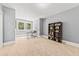 Spacious office with neutral walls, carpet and natural light at 6840 Early Jersey Rd, Meggett, SC 29449